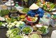 Vietnam: Fruit and vegetable vendor in a fresh market in Hue, central Vietnam